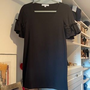 Cute super short black dress.